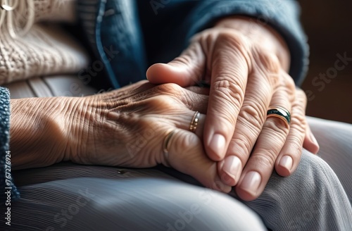 Elderly people's hands touching each other, tenderness, care © Elena