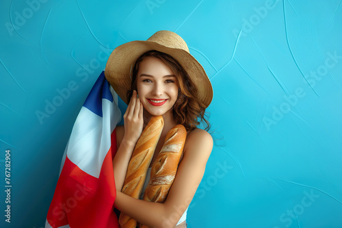 A woman wearing a hat and holding a flag, representing France, with baguettes on a blue background. photo