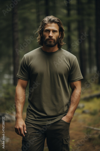 Male model posing outdoors with plain blank green canvas t-shirt mockup