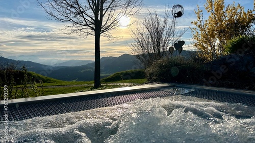 Hot tub with a view of the mountains at sunset