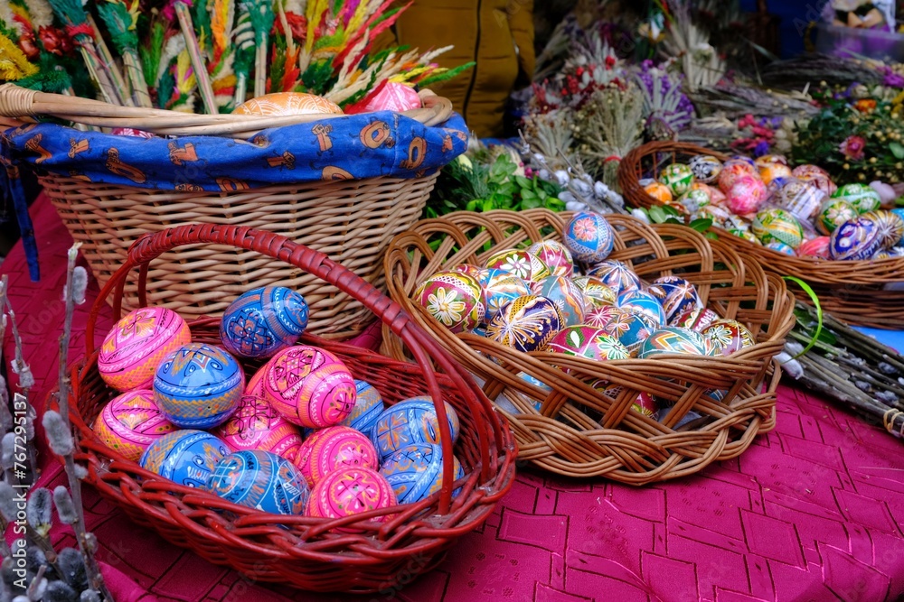 Fototapeta premium Beautiful handmade colorful Easter eggs in a basket. Kurpie, Poland