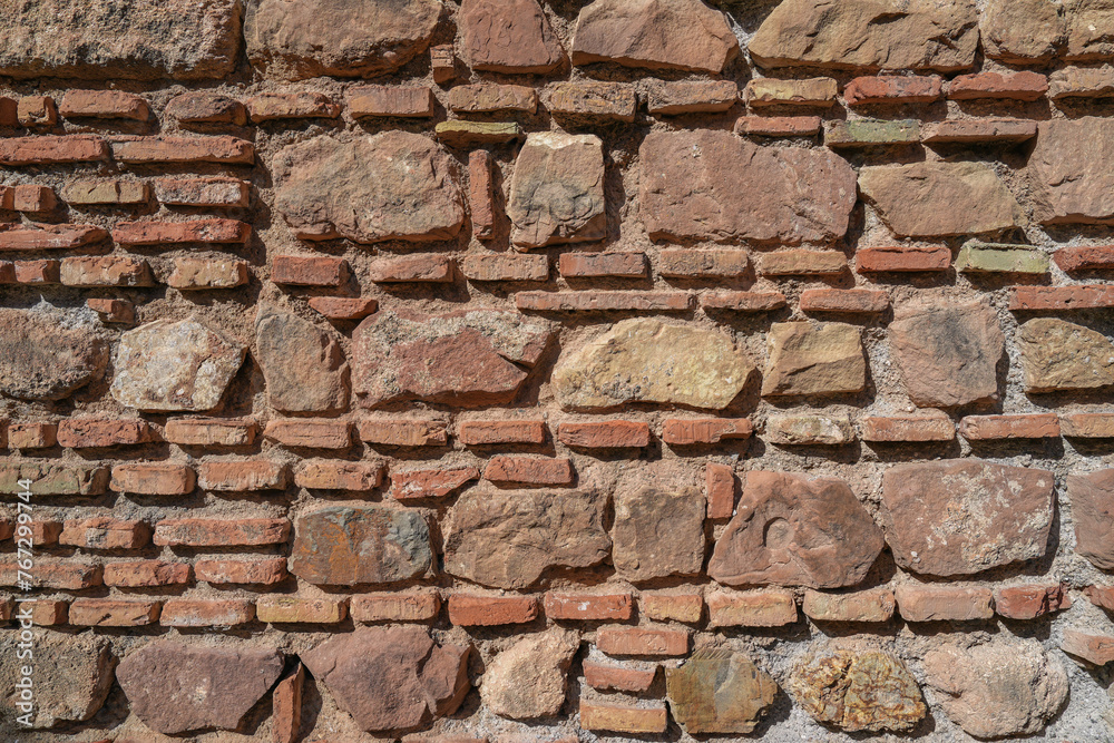 Fototapeta premium Old brick wall textures of the Alcazaba Palace in Malaga