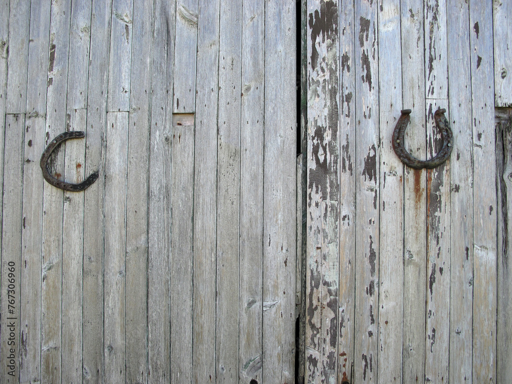 Horseshoe on an old wooden barn door - Portsoy - Aberdeenshire - Scotland - UK Horseshoe on an old wooden barn door - Portsoy - Aberdeenshire - Scotland - UK