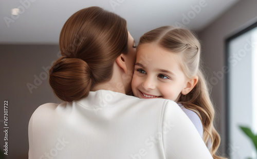 Young loving mother hugging her child - daughter. Young family. Mother's day