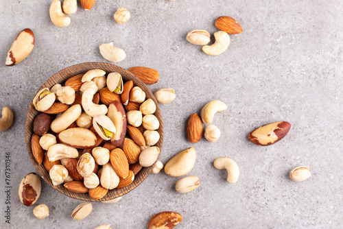 Healthy mix nuts on wooden background. Almonds, hazelnuts, cashews, peanuts, pistachios, Brazil nuts