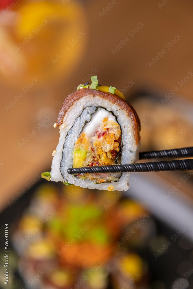 Vegan sushi roll made with marinated tomato and mixed vegetables Vegan sushi roll made with marinated tomato and mixed vegetables