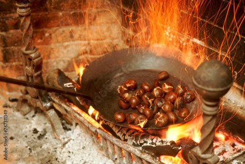 Chestnuts roasting on an open fire. photo