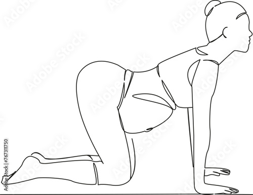 pregnant woman in cat pose