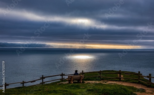Son overlooking the sea with sun spotlight. © James Sakaguchi