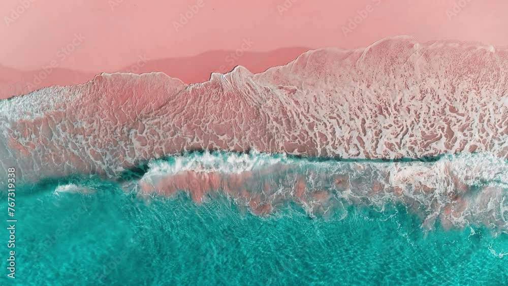 Calm view of a transparent wave on a tropical paradise beach of the Caribbean Sea. Turquoise waves on pink sand. Green sea waters. Waves crash on the sandy beach. Changeable windy weather.