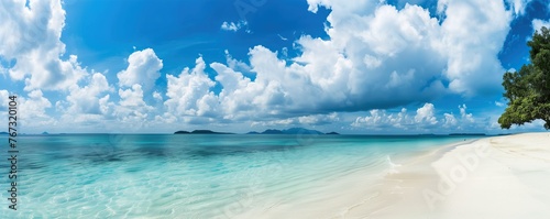 Beautiful beach with turquoise water and white clouds in the blue sky