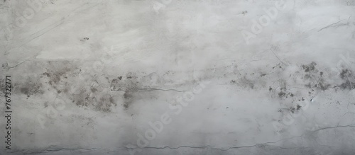 A closeup of a freezing grey concrete wall covered in mold. The monochrome photography captures the winter landscape with snow, creating a striking pattern photo