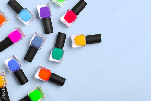 Pattern background of bottles colorful nail polish, top view, copy space
