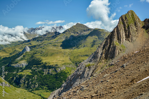 The landscape of the French Pyrenees, a beautiful peak with greenery in the background