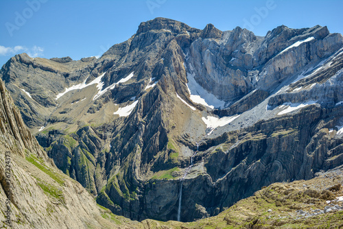 Cirque De Gavarnie, a beautiful waterfall and glacier in the French Pyrenees in summer with snow