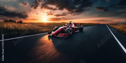 Une voiture de course rouge roulant sur une route de campagne au coucher du soleil, image avec espace pour texte.