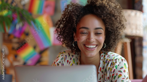 Happy young lesbian woman working remotely virtual video team meeting call, remote work & flexible inclusive culture, smiling black digital nomad freelancing on laptop at pride, rainbows, copy space 