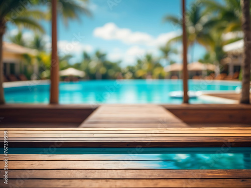 Wooden table pool bokeh background  empty wood desk product display mockup with blurry tropical hotel resort abstract poolside summer travel backdrop advertising presentation. Mock-up  copy space