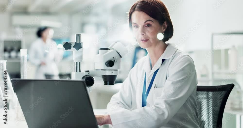 Mature woman, microscope and laboratory for science with laptop, thinking and check for results. Person, scientist and data analysis for sample, bacteria or particles with computer in lab with ideas Mature woman, microscope and laboratory for science with laptop, thinking and check for results. Person, scientist and data analysis for sample, bacteria or particles with computer in lab with ideas