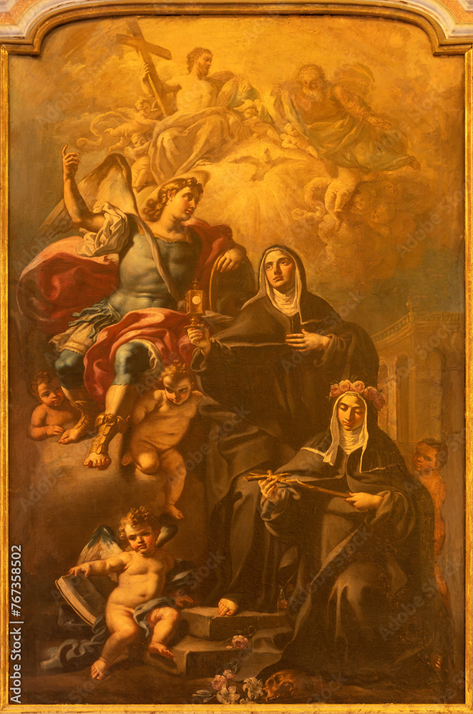 NAPLES, ITALY - APRIL 22, 2023: The painting of St. Michael archangel, and St. Catherine of Siena in church Basilica dell Incoronata Madre del Buon Consiglio by Nunzio Rossi (1626 –1651).