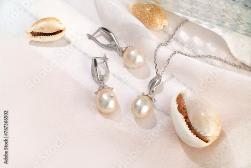 Elegant jewelry set. Jewellery set with gemstones. Product still life concept. Ring, necklace and earrings.
