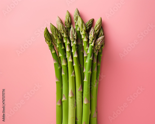 Fresh Asparagus Spears Lined Up on Pastel Pink Background