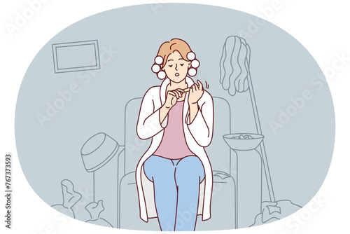 Carefree woman with curlers on hair sits on armchair taking care of nails ignoring garbage in apartment. Lazy girl does not want to clean up is resting in house with mess. Flat vector design