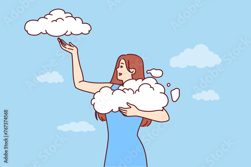 Woman takes clouds from sky, enjoying clear weather and fresh air available thanks to clean environment. Young girl seeing wonderful dream about opportunity to hold clouds with firmament in hands
