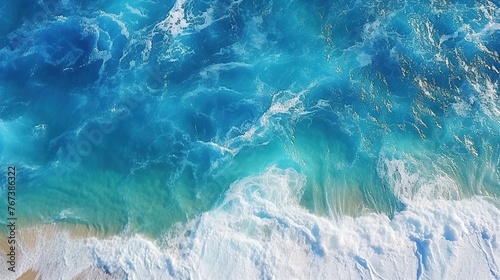 Beautiful blue ocean water wave during the day. Aerial top down view photo.