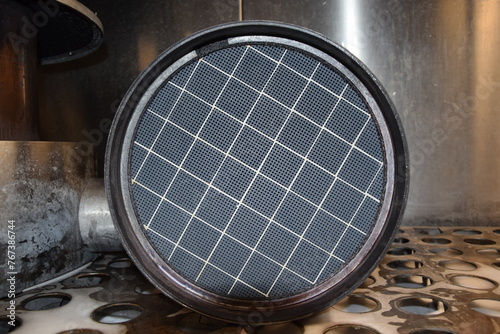 фотографія Truck DPF closeup, FAP, Diesel Particulate Filter, clean filter DPF from truck from above