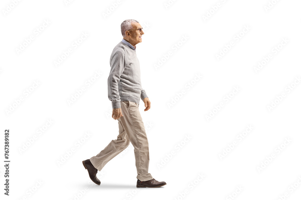 Full length profile shot of a mature gentleman walking Full length profile shot of a mature gentleman walking