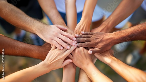 Group of people putting their hands together in a circle. Unity concept.