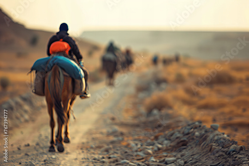 Golden Hour Caravan Journey Across the Desert Landscape Banner © Алинка Пад
