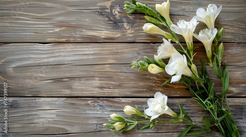 mockup of freesia flower on wooden background