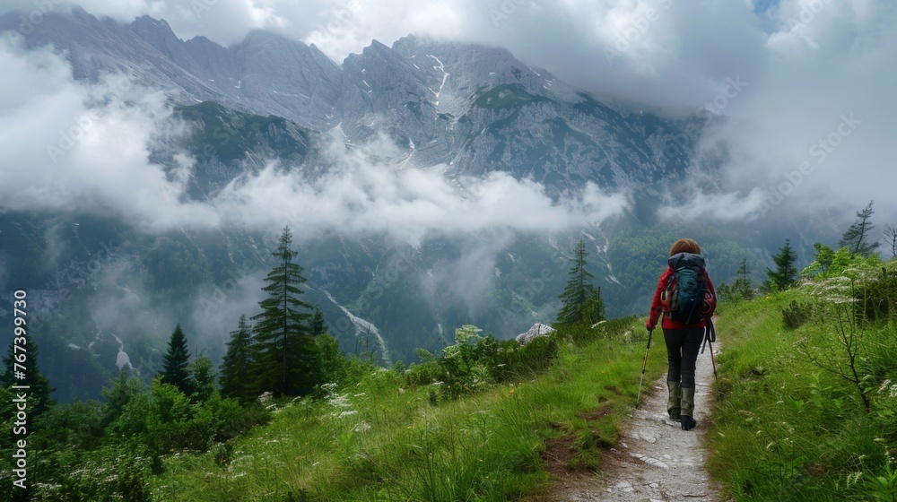 Hiker on Mountain Trail with Foggy Peaks Hiker on Mountain Trail with Foggy Peaks