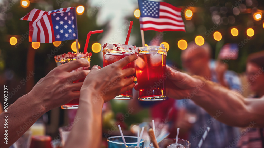 Friends toasting with American flag-decorated drinks at a 4th of July party. - obrazy, fototapety, plakaty 