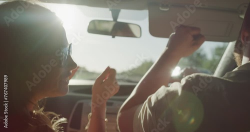 Driving, car and couple dance on road trip, street journey or summer travel for fun romantic adventure on Canada vacation. Transport vehicle, radio music and back of marriage people listening to song