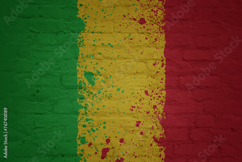 colorful painted big national flag of mali on a massive brick wall