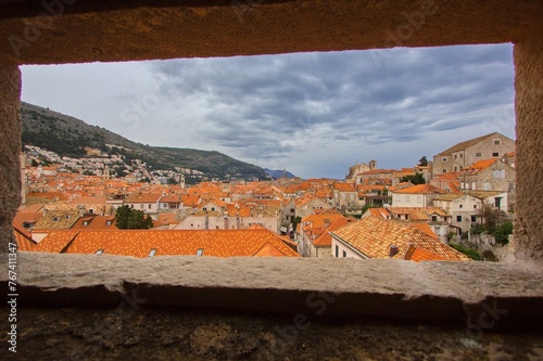 View through the fort window to the rooftop of Old town in Dubrovnik, Dalmatia, Croatia.