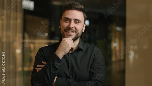 Caucasian businessman millennial 30s man executive business company in office portrait happy male entrepreneur salesman manager raise head looking at camera flirt smiling toothy dental smile laughing