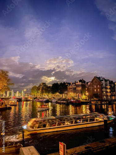"Amsterdam's Evening Glow: Love Lights on the Canal"