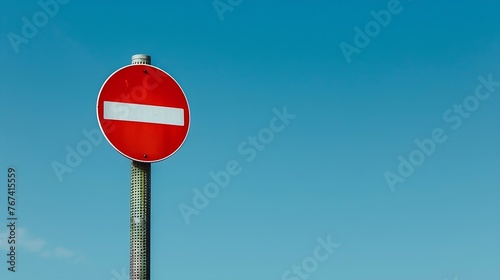 Generative AI : No entry for vehicular traffic. Road sign against blue sky. A circular red sign with a white bar indicating 'NO ENTRY' 