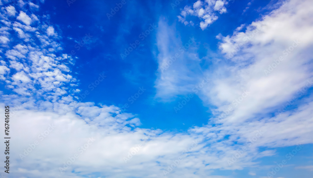 Fototapeta premium Clear blue sky with some white clouds