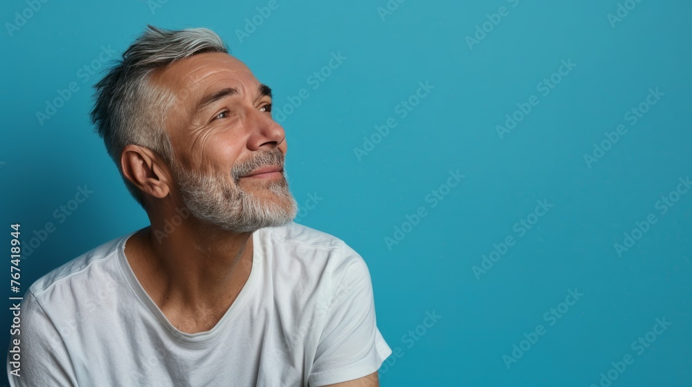 Obraz premium Prime Adult Male Embracing with Copy Space - Isolated on Blue Background