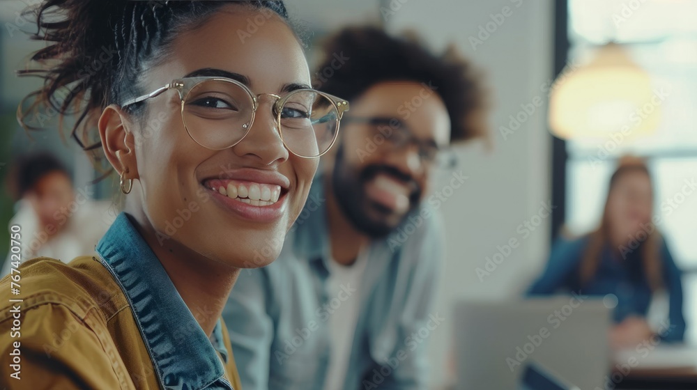Two Young Business Colleagues Working Together in a Startup Office Two Young Business Colleagues Working Together in a Startup Office