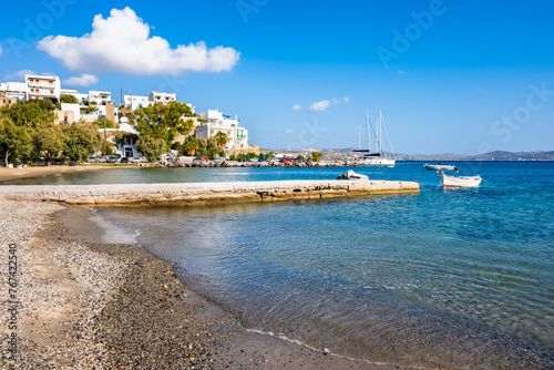 Idyllic beach in Adamas port bay, Milos island, Cyclades, Greece