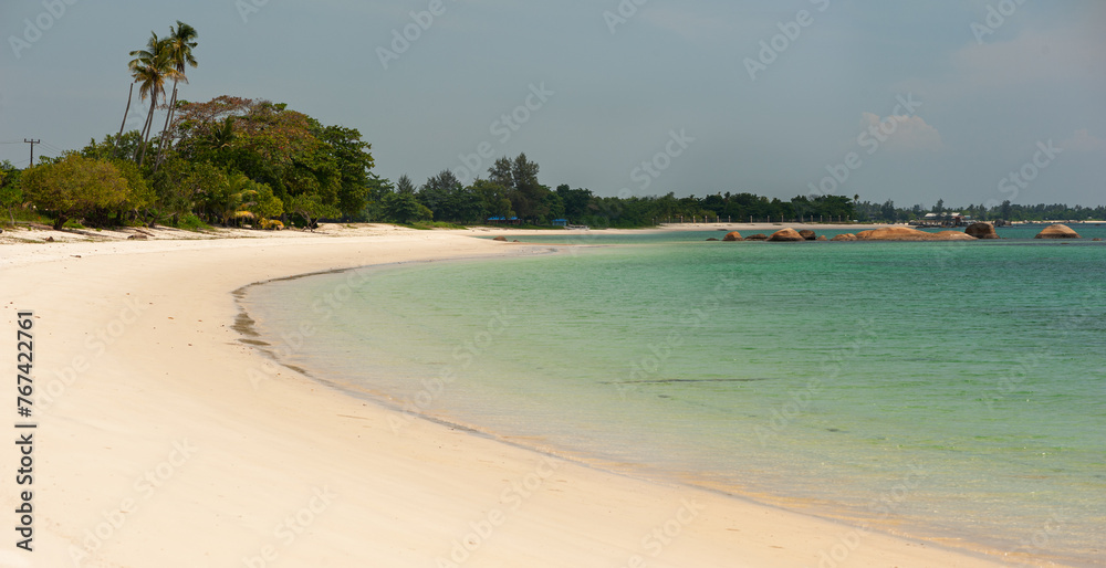 Nice white sand beach with calm turquoise blue water with huge granite stone Pantai Mabai, Belitung, Sumatera, Indonesia