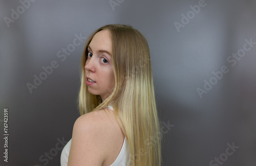Blonde Girl Facial Expression Thinking Smiling, Thought, Education, People Express, Face Close Up, Female, Woman, Isolated Background, pointing to Head,
