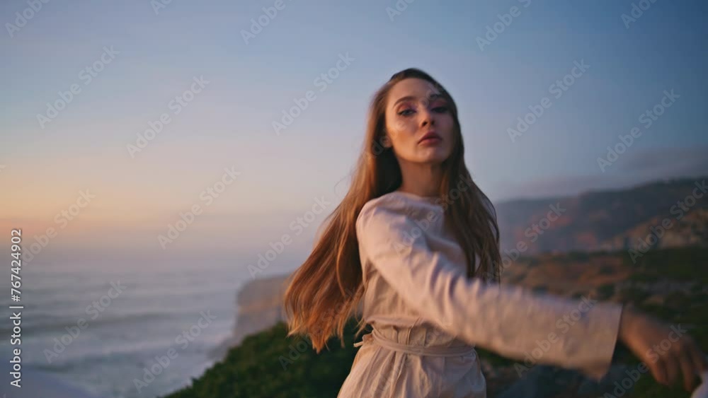 Sensual dancer moving cloth performing contemporary style at evening closeup