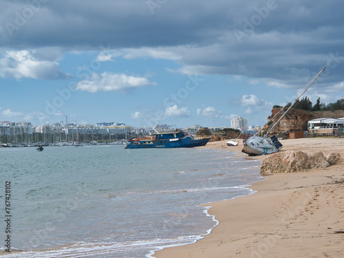 Ferragudo, Algarve, Portugal - 03 11 2024. Storm's Aftermath: Boats Stranded on Ferragudo Coastline.